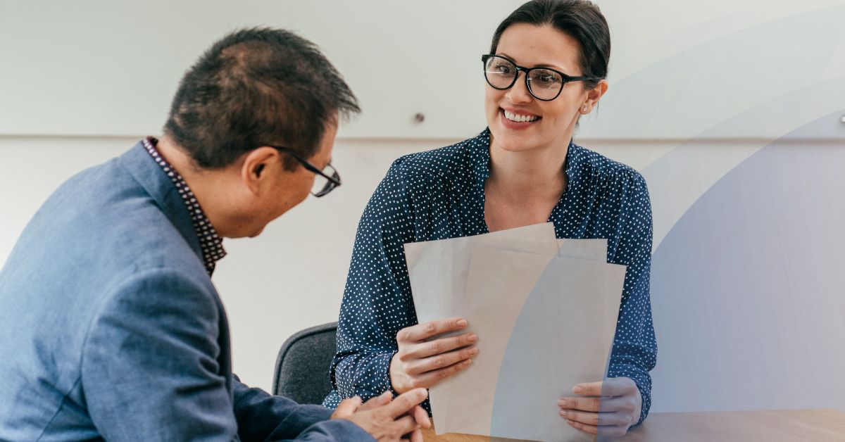 Hiring manager reviewing behavioral assessment results during a candidate interview